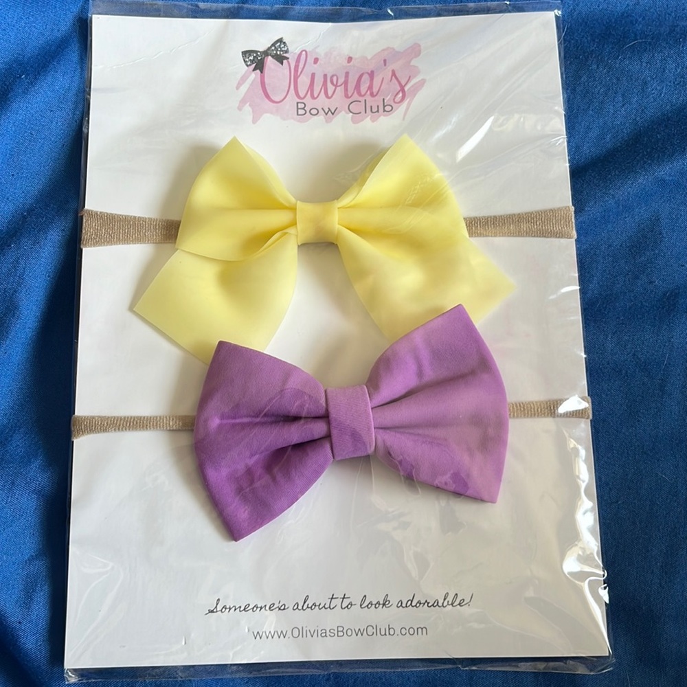 Yellow and purple head bows